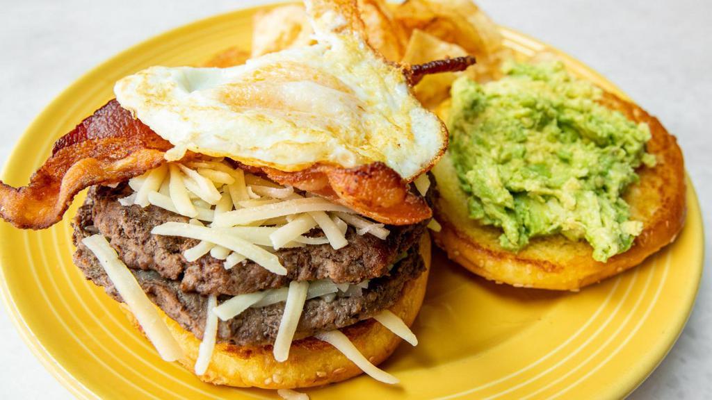 Wake Up Burger · 1/2 lb Black Angus burger  grilled and topped with crispy  all-natural nitrate free applewood bacon, a fried egg, avocado and American cheese, topped with FB burger sauce, and choice of side.