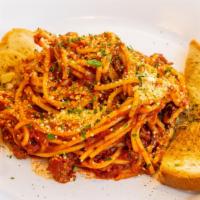 Classic Spaghetti & Meat Sauce · Ground chuck with roasted tomato and garlic spaghetti sauce topped with parmesan, served wit...