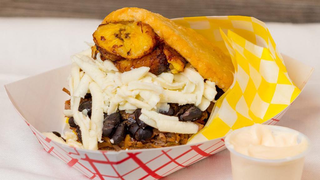 Pabellón · Shredded beef, black beans, white cheese and sweet plantains.