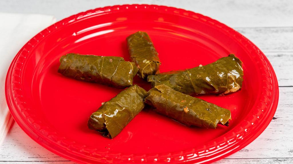 Grape Leaves (4 Pcs) · Grape leaves stuffed with rice and dill.