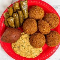 Sampler Platter · Consisting of falafel, hummus, grape leaves, kibbeh and fries.