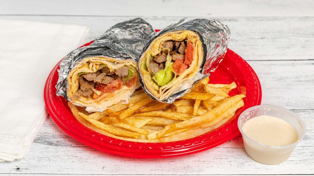Beef Shawarma · With lettuce, tomatoes, onions and hummus sauce.