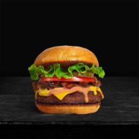 Classic Burger · American beef patty topped with lettuce, tomato, onion, and pickles. Served on a warm bun.