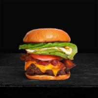 Bacon & Egg · American beef patty topped with bacon, fried egg, avocado, melted cheese, lettuce, tomato, o...