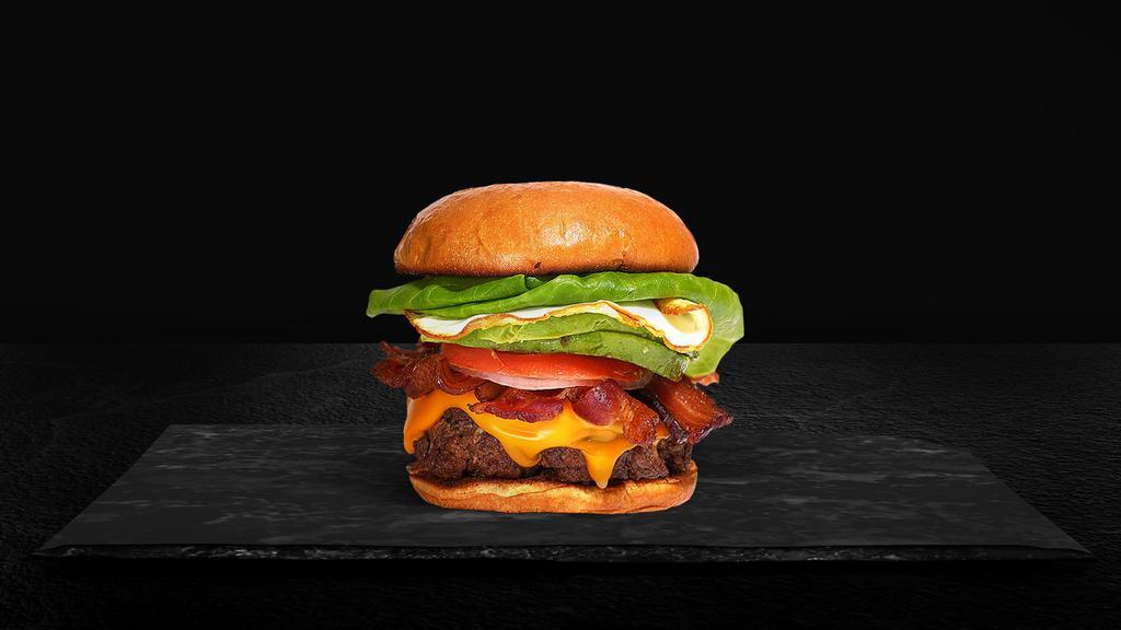 Bacon & Egg · American beef patty topped with bacon, fried egg, avocado, melted cheese, lettuce, tomato, onion, and pickles. Served on a warm bun.