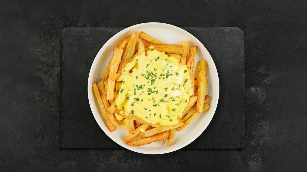 Cheese Fries · Idaho potato fries cooked until golden brown and garnished with salt and melted cheddar cheese.
