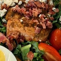 Blackened Salmon Cobb Salad · Signature cobb salad with fresh kale, red onions, grape tomatoes, boiled eggs, bacon bits, b...