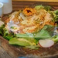 Rene Salad · A mix of organic greens, salmon, imitation crab, avocado, and sesame seeds with our homemade...