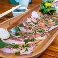 Tuna Tataki · Lightly seared tuna tataki. Served with ponzu sauce, scallions, and sesame seeds.