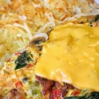 Veggie Omelette · Sautéed mushrooms, tomatoes, peppers, onions, and spinach.