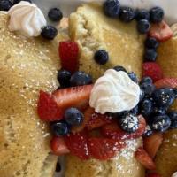 Fresh Blueberry Pancakes · Blueberries mixed into three buttermilk pancakes.