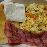 Traditional Breakfast  · A toasty Arepa, eggs scrambled with tomato slices & onions, served with fresh cheese and 2 s...