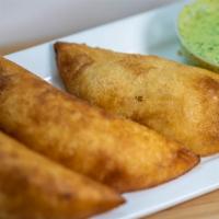 Venezuelan Empanada  · Traditional corn Venezuelan Empanada stuffed with your choice of all shredded beef, chicken,...