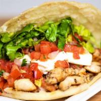 Grilled Chicken Arepa · Our gluten-free and corn-based flour cake, grilled and toasted to a savory perfection stuffe...