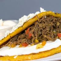 Shredded Beef Or Chicken Cachapa (Carne O Pollo Mechado) · Thick, yellow sweet venezuelan corn-based pancake stuffed with our all natural shredded beef...