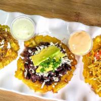 Mini Tostones · 3 fried yellow plantains served with your choice of protein, black or pinto beans, lettuce, ...