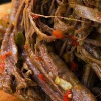 Shredded Beef  8 Oz(Carne Mechada) · All natural beef mixed with homemade sauce and sauteed onions, green and red peppers.