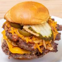 The Big Texas Burger · The BIG Texas Burger features double Certified Angus Beef, American & Cheddar cheese, Texas-...