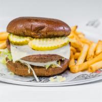 Impossible Burger™ · The Impossible™ (vegan) patty, topped with American  cheese, with lettuce, tomato, onions, p...