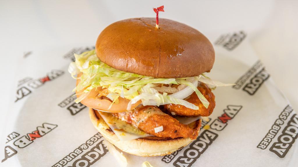 Buffalo Chicken Sandwich · Fresh breaded chicken tossed in our WNB hot sauce, drizzled with ranch dressing, topped with Swiss cheese. lettuce, tomato, onions and house sauce.
