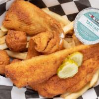 Flounder Platter · Hand breaded fresh Flounder filets.  Includes Fries, Hushpuppies