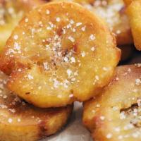 Tostones (Fried Flattened Plantains) · 