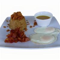 Boricua Breakfast · Mash  green plantains mixed with garlic and fried pork rinds with two eggs any style and bac...