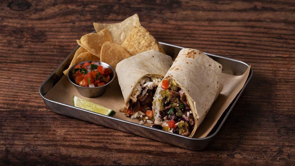 Carne Asada Burrito Burrito · Burrito with grilled steak, white rice, black beans, pico de gallo, and salsa on a flour tortilla