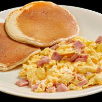 Deluxe Mezclado · Two scramble eggs+chopped ham+pancakes+fresh fruit+cuban toast+cafe con leche
