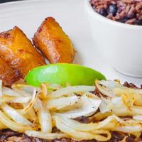 Vaca Frita · Flat iron grilled shredded beef+cooked onions