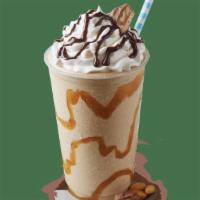 Snickers Shake · Caramel swirl, Snickers®, and Sweet Cream Ice Cream topped with whipped cream, Hershey’s® ch...