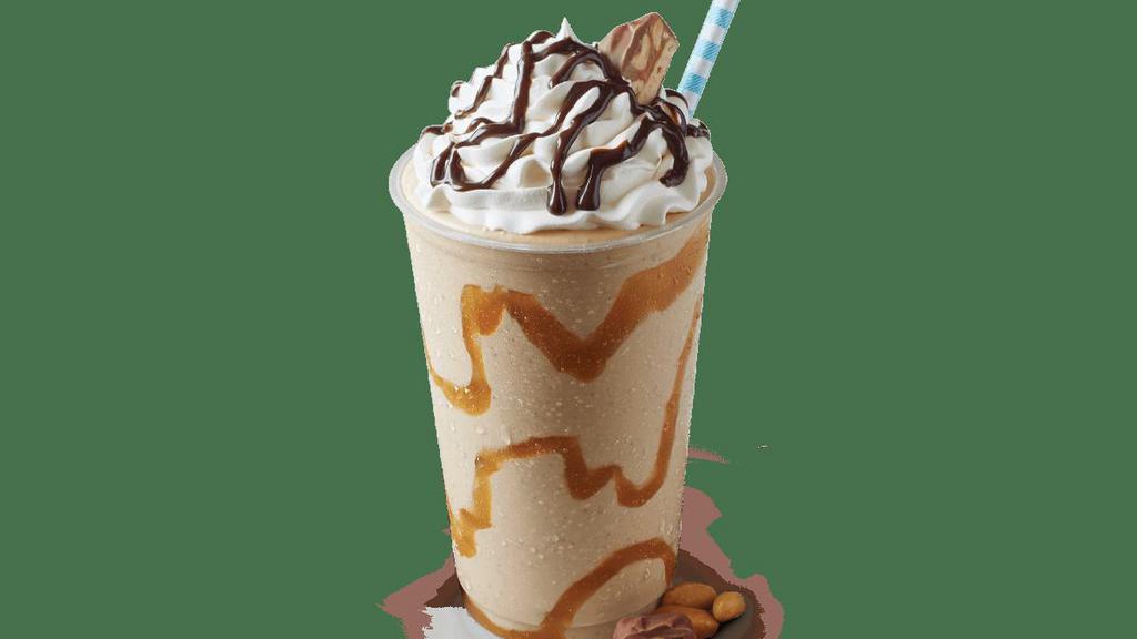 Snickers Shake · Caramel swirl, Snickers®, and Sweet Cream Ice Cream topped with whipped cream, Hershey’s® chocolate syrup, and crushed Snickers ® bar.
