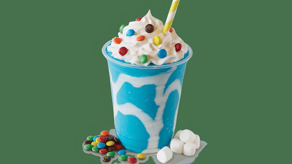 Cotton Candy Shake · Marshmallow cream swirl and Blue Cotton Candy Ice Cream topped with whip cream and mini M&M’s®.