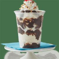 Classic Sundae · Vanilla ice cream with choice of fudge or caramel, topped with whipped cream, chopped peanut...
