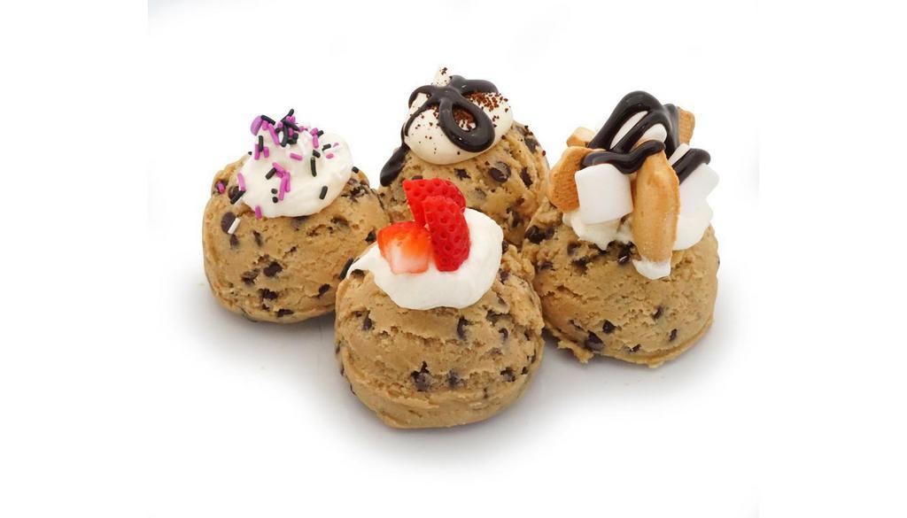 Cookie Dough Scoop - Build Your Own* · our homemade cookie dough topped with one frosting and one topping of your choice