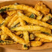 Zucchini Fries · Crispy Zucchini Strips hand cut, hand battered, and deep fried to order. Served with our swe...