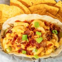 Johnny Utah · Smoked pork, BBQ sauce, mac and cheese, pickle, bacon dust, scallion, served on a grilled fl...