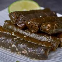 Yabrak Inab · Traditional grape leaves stuffed with rice and ground beef.(6 unit)