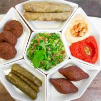 Faraon King Mix · A combination of two dips, three falafel, two fried kibble, four yabrack, four yabrack malfo...