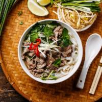 Tripe Pho · House-made, slow simmered, clear beef broth flavored with star anise, cinnamon, cloves, cori...