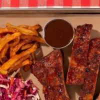 Bbq Smoked Pork Ribs · House smoked pork ribs served with 2 signature sides.