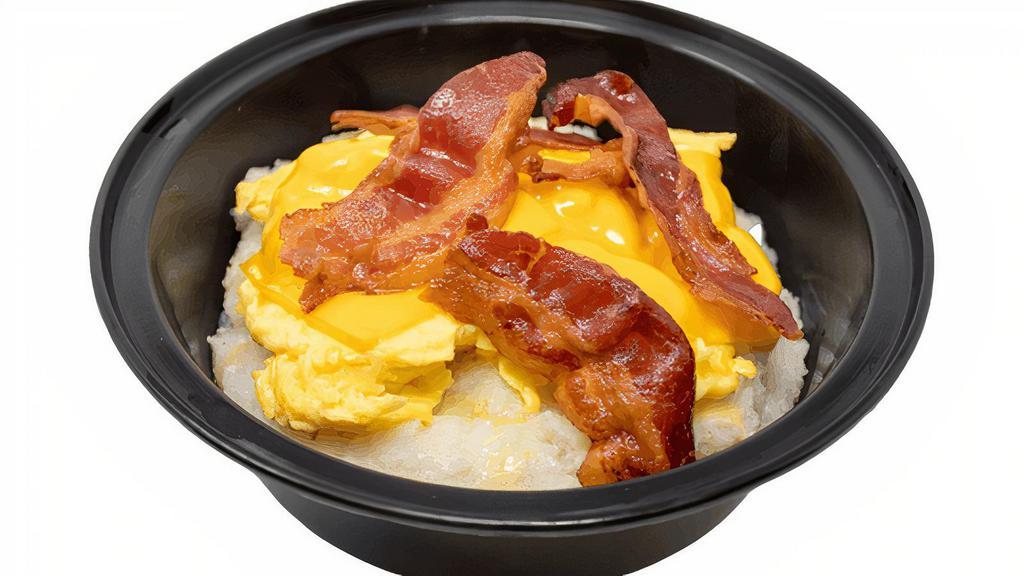 All American Grits · Bowl of made-from-scratch grits loaded with scrambled eggs, American cheese, and bacon