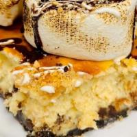 Smore Cheesecake · We have taken our signature cheesecake to the next level with marshmallows, chocolate chips ...