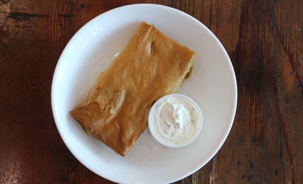 Spinach Pie · Vegetarian. Spanakopita. Flaky phyllo dough stuffed with a mixture of spinach and feta cheese. Served with tzatziki sauce. 700 cal.