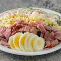 Chef Salad · Mixed greens, cucumber, tomato, egg, ham, turkey, and cheese.