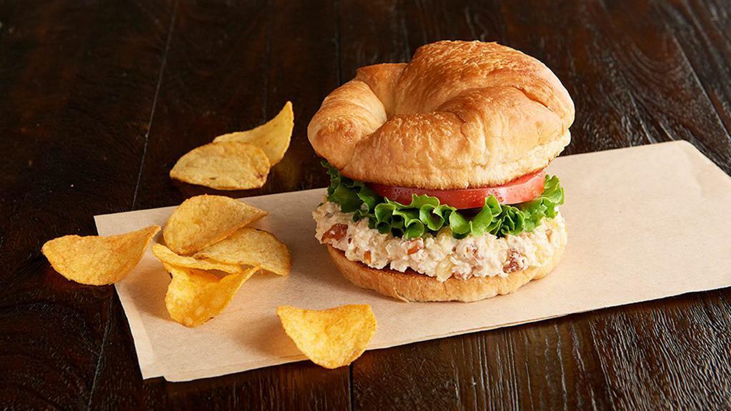Shelley'S Deli Chick (Manager'S Special) · A half sandwich served with your choice of a cup of soup, fresh fruit or Mac & Cheese. Our family-recipe chicken salad with almonds and pineapple, leafy lettuce, tomato, on a toasted croissant.