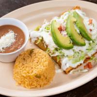 Flautas · Fried rolled tortillas filled with choice of meat beef, or chicken. Topped with lettuce, tom...