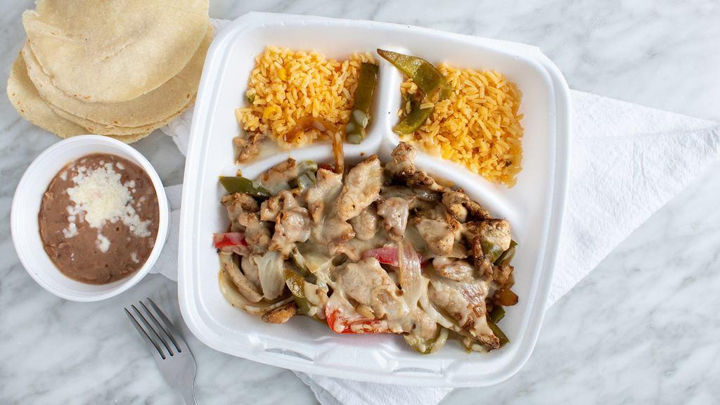 Fajitas De Pollo (Chicken Fajitas) · Marinated grilled strips of chicken seared with cheese, onions, and bell peppers,  topped with mozzarella cheese with 5 tortillas,only  2 companions, rice, beans, salad,fries, maduros, sweet plantains, or tostones.