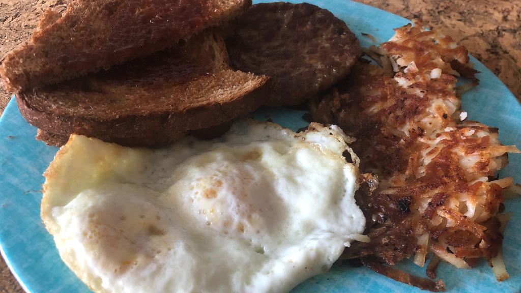 Breakfast Plate · Two eggs, choice of meat, hash browns, or grits with toast.