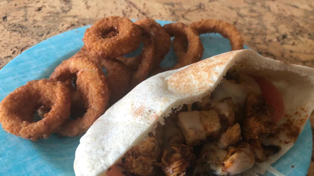 Grilled Chicken Pita · Chopped grilled chicken breast with our special seasoning and melted cheese in a pita. Add fries or onion rings.